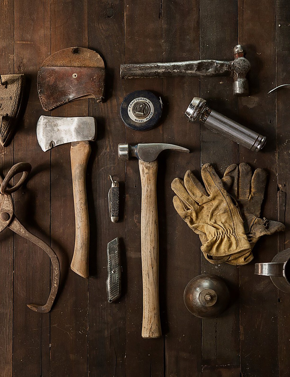Hand tools laid out on a workbench